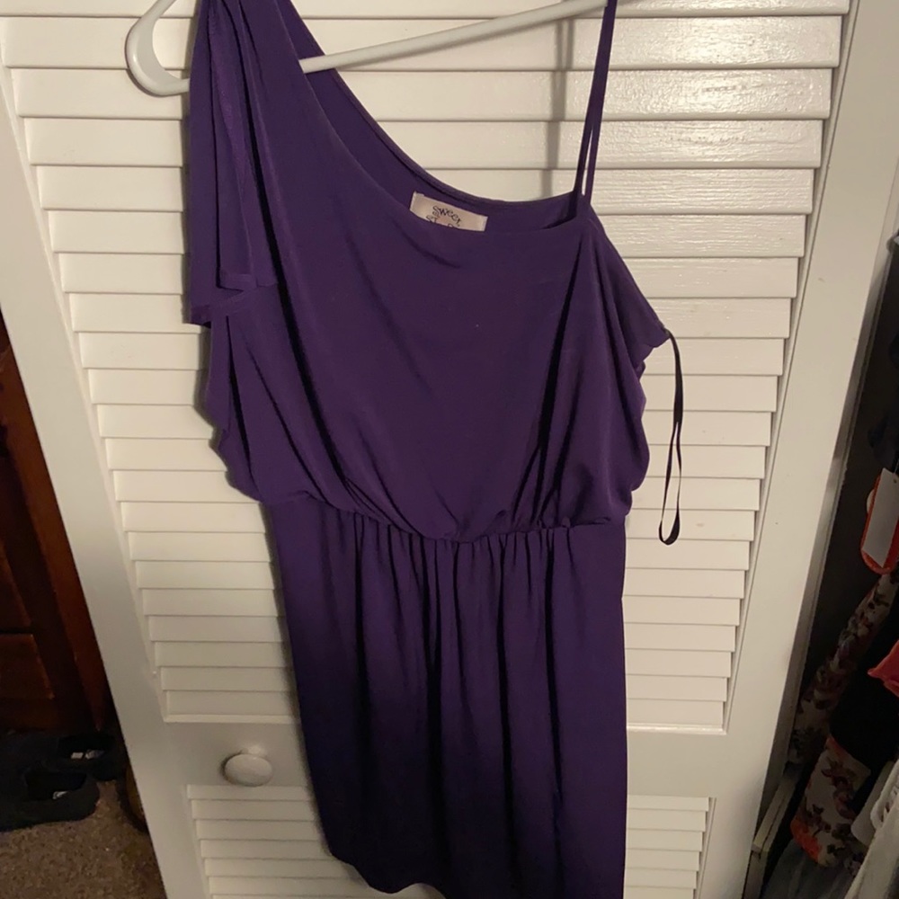 Short purple dress. One side has a short sleeve the other side is sleeveless.